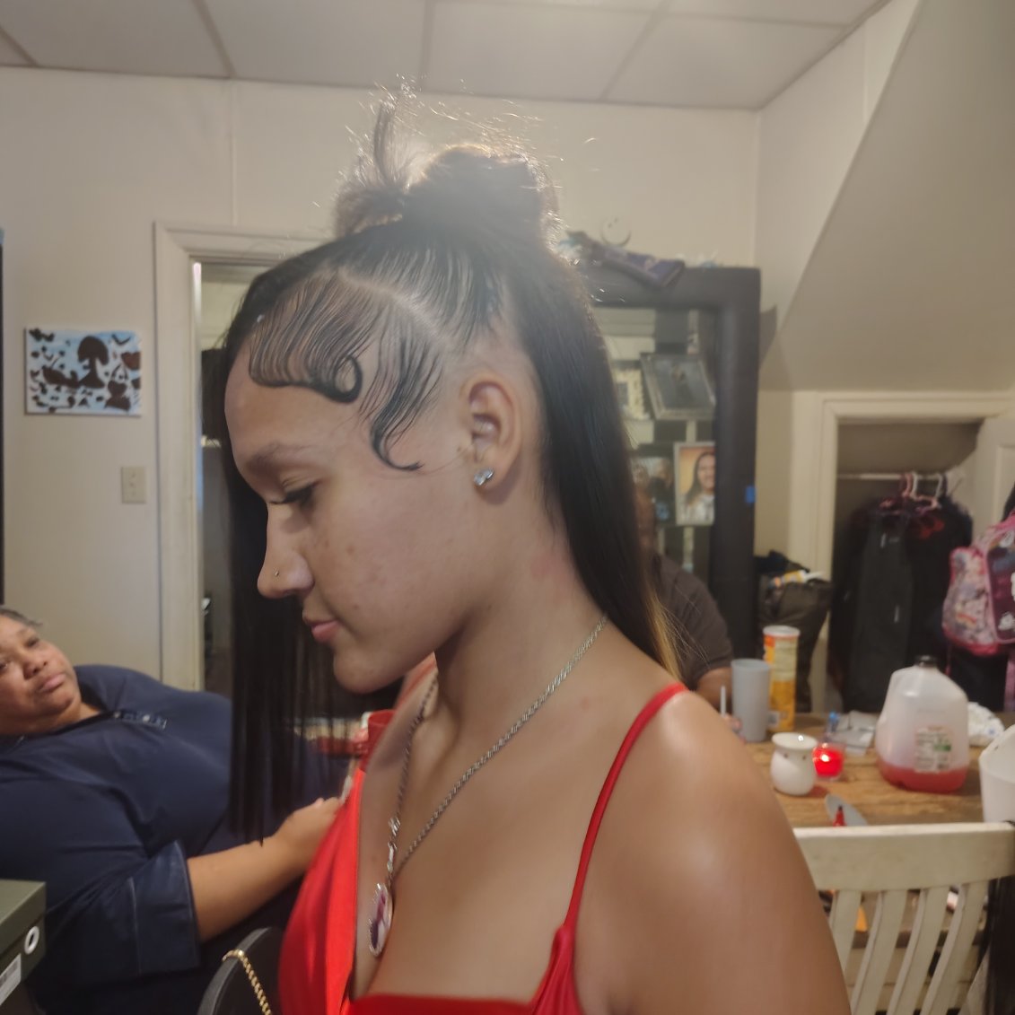 A high ponytail with laid baby hairs, styled by Jazmiane
