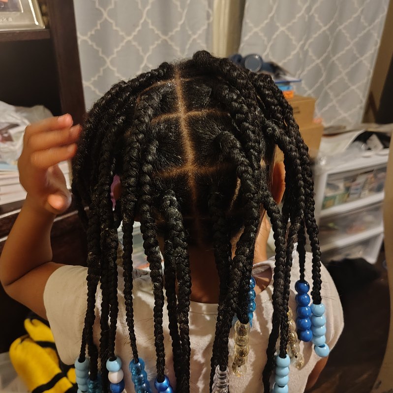 Small braids finished with light blue and clear beads